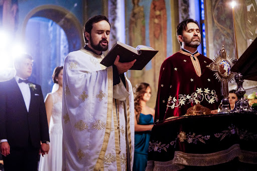 Orthodox priest prays at wedding