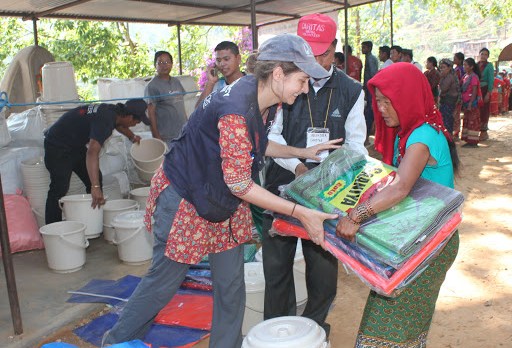 CRS worker distributes aid in Nepal