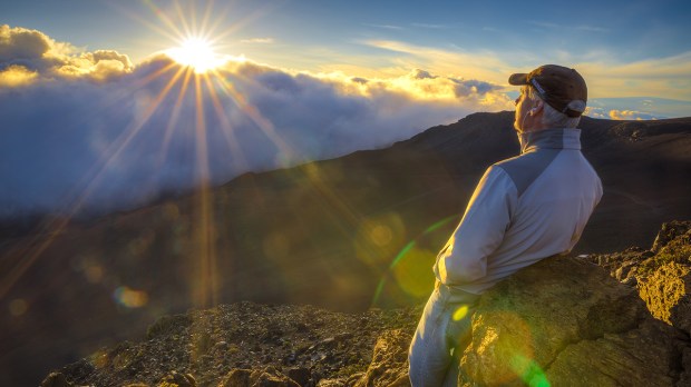 web-man-mountain-sunrise-clouds-lens-flare-dave-dugdale-cc