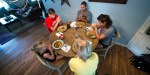 FAMILY PRAYS BEFORE DINNER