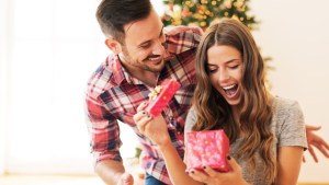 Man giving a Christmas present to his girlfriend