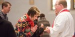 WOMAN,PRIEST,COMMUNION