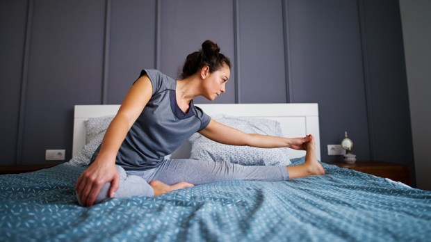 WOMAN,EXERCISE,BED