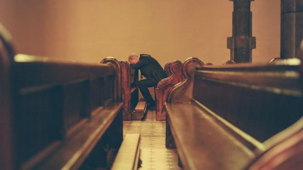 MAN,PRAYING,CHAPEL