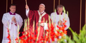 Why does the priest sprinkle us with water at Mass?