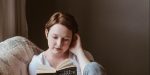 WOMAN, READING, SOFA