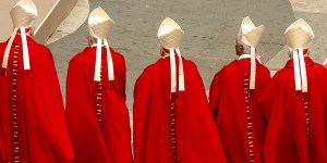 Why do cardinals put their title in the middle of their name?