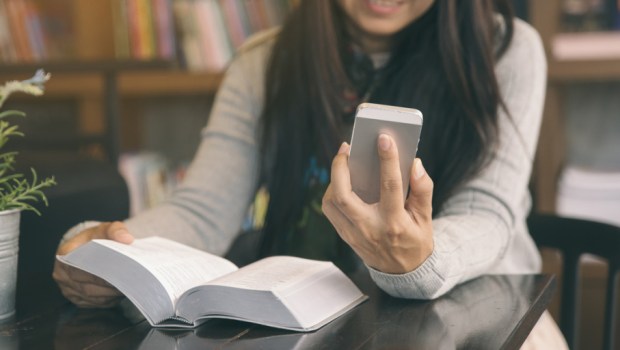 WOMAN LOOKING AT PHONE