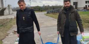 This priest in Kyiv wears a bulletproof vest over his cassock