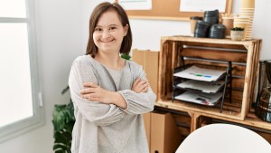 brunette woman with Down syndrome at the office