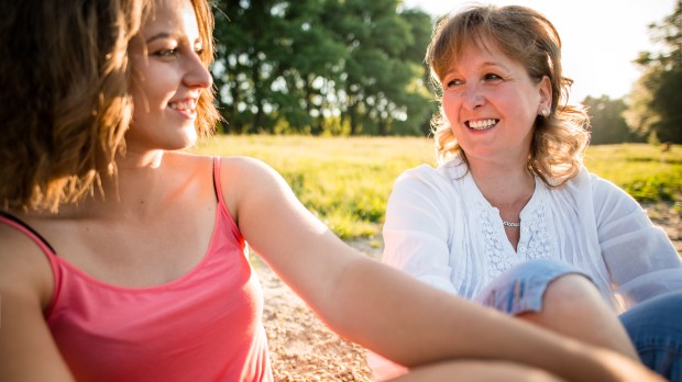 mother & daughter talking outside