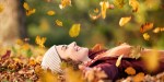 Woman-lying-over-autumn-ground-relaxing-at-park-shutterstock