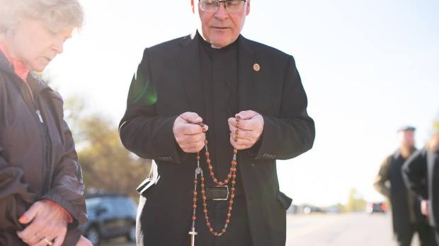 Father Bryan Brooks prays rosary outside penitentiary in Oklahoma