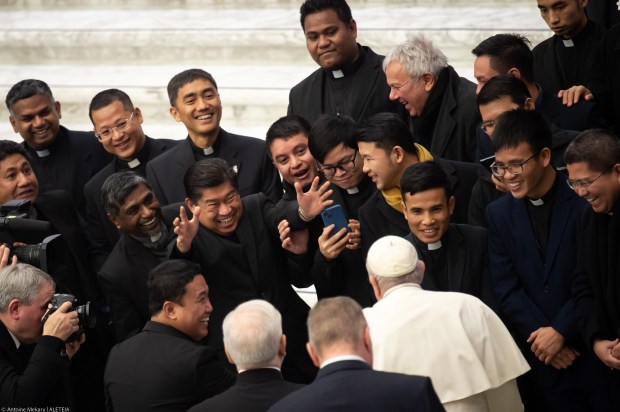 Pope Francis meets with priest at the end of his weekly general audience in Paul VI Hall