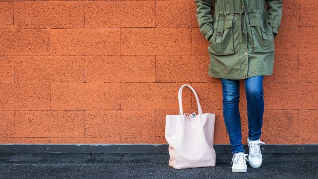 woman leaning against wall