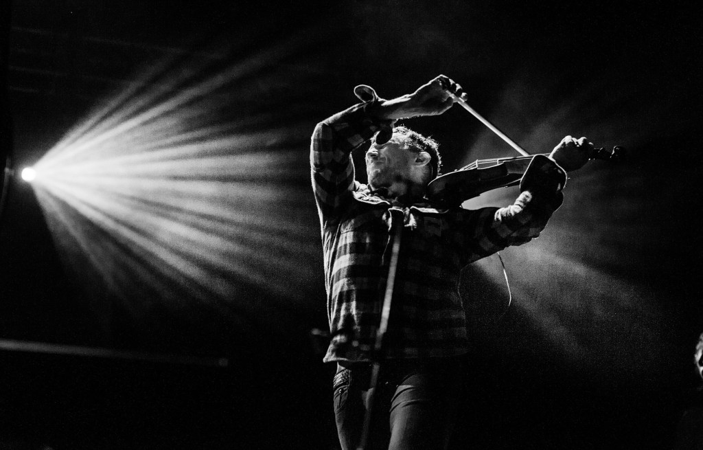 Alexander Fedoryka of Scythian onstage with violin