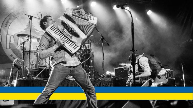 Danylo Fedorkya of Scythian on stage with accordion