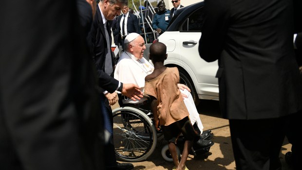 A-young-South-Sudanese-boy-reaches-out-to-greet-Pope-Francis-outside-the-Cathedral-of-Saint-Therese-in-Juba-AFP