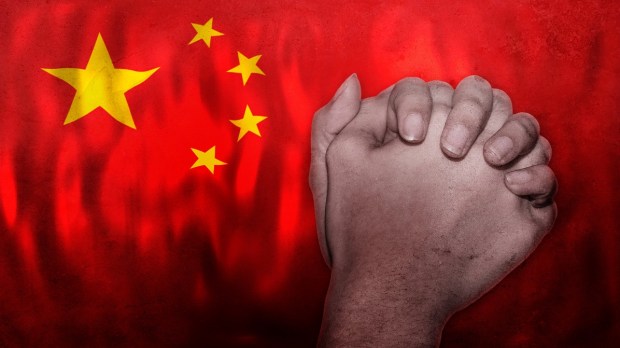 Chinese flag and Christian prayer hands