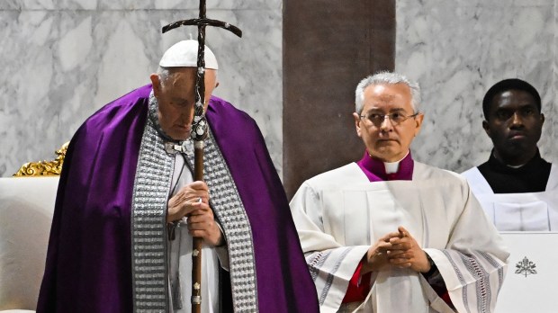 Pope Francis prays during the celebration of Ash Wednesday