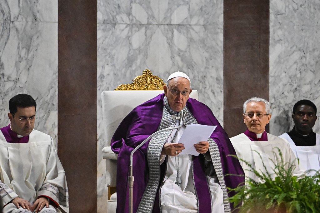 Pope Francis prays during the celebration of Ash Wednesday