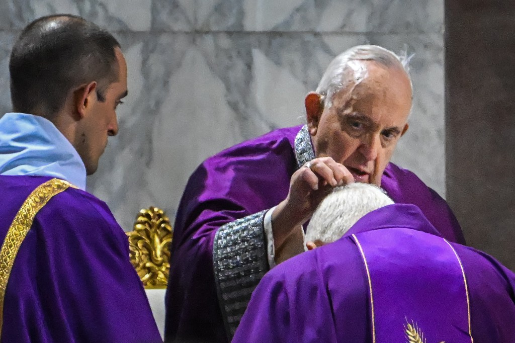 Pope Francis prays during the celebration of Ash Wednesday