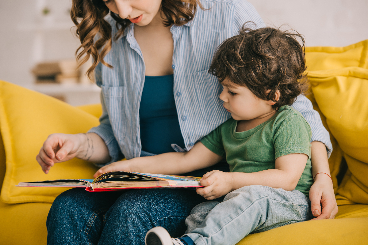 mother and son reading book