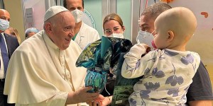 Pope visits kids, baptizes baby in hospital
