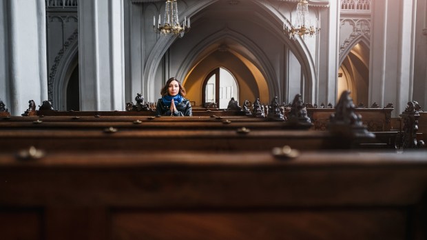 Lone Hispanic woman in church