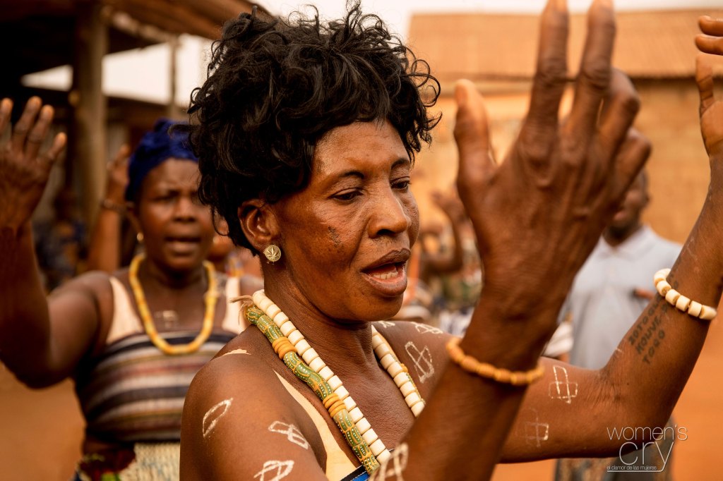 An indigenous woman doing a traditional dance in Togo