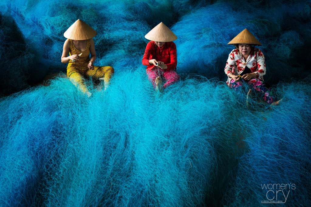 Women at work making nets out of plastic