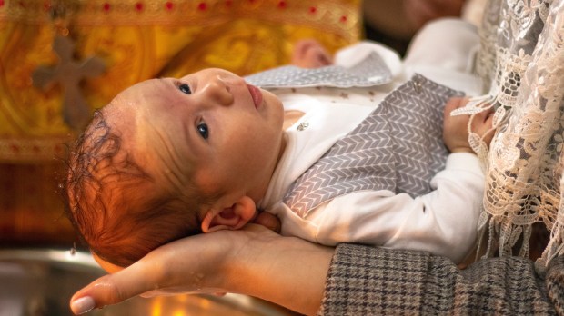 Ukrainian child being baptized