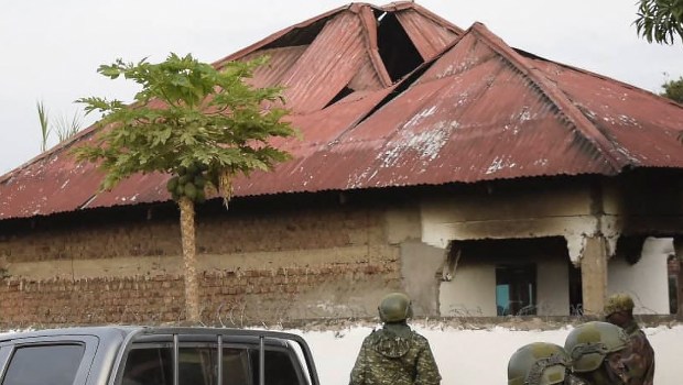 Uganda-security-forces-are-seen-standing-at-the-premises-of-an-attack-in-Mpondwe-Lhubiriha-Secondary-School-Uganda