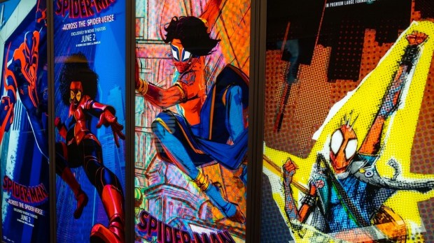 Row of posters for Spider-Man: Across the Spider-Verse in lobby of movie theater