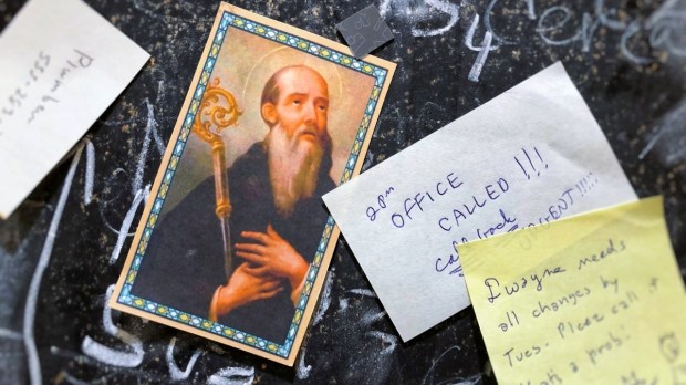 St. Benedict card on home message board