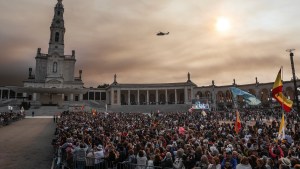 An helicopter of the Portuguese Airforce carrying Pope Francis flies over the Shrine of Our Lady of Fatima