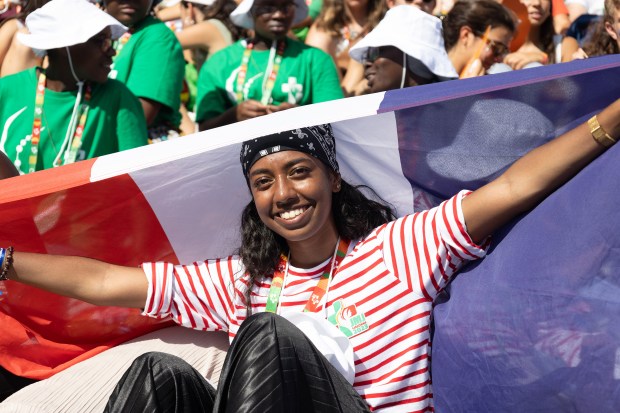 Pilgrims attend the opening mass of the World Youth Day 2023