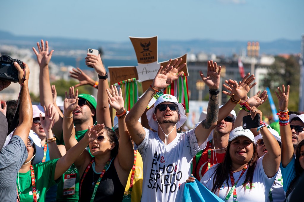 Pilgrims attend the opening mass of the World Youth Day 2023