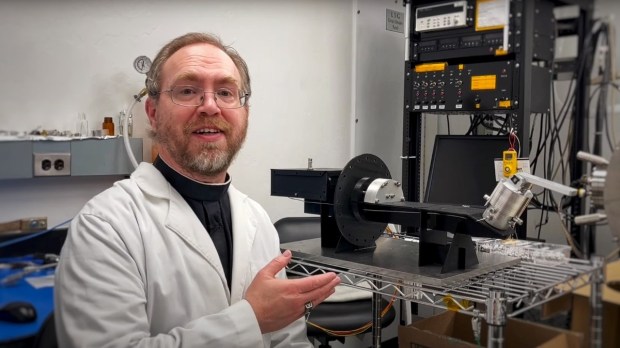 Brother Bob Macke shows off Pycnometer for NASA OSIRIS-REx Mission