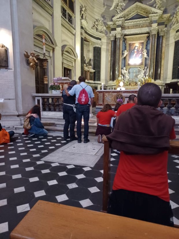 The New Horizons Community doing a "light in the darkness" eucharistic adoration as part of their evangelizing street mission in Rome