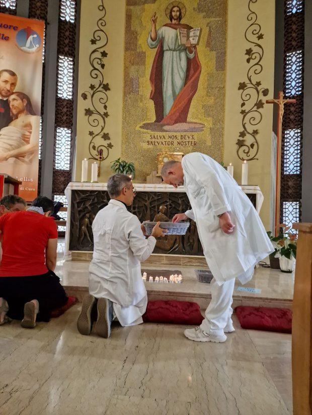 The New Horizons Community doing a "light in the darkness" eucharistic adoration as part of their evangelizing street mission in Rome