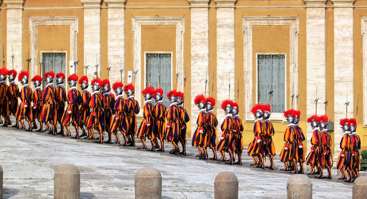Swiss guard marching up hill