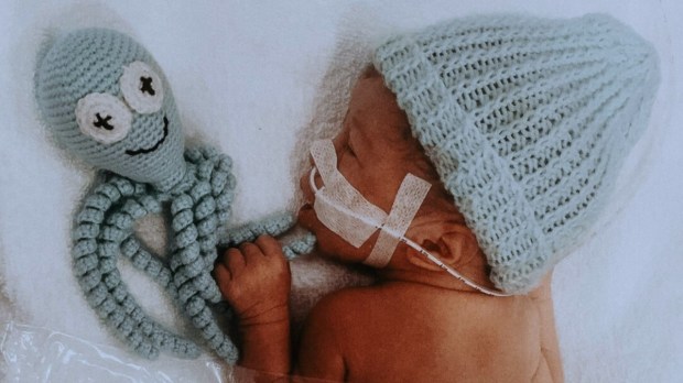 Preemie baby with knit octopus