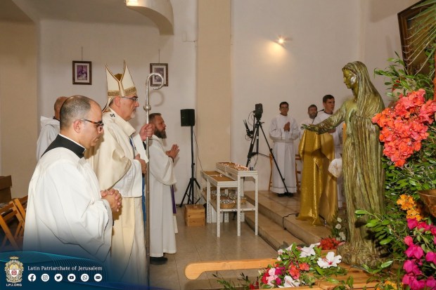 Latin Patriarch of Jerusalem Pierbattista Pizzaballa prays before Our Lady Queen of Palestine statue
