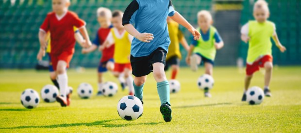 Little kids running at soccer practice