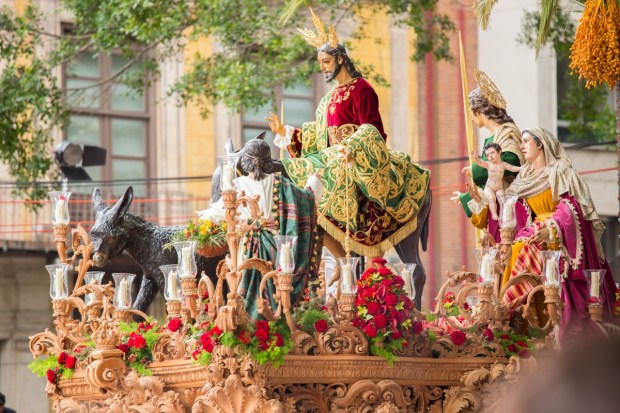 Jesus riding donkey on float Palm Sunday Spain