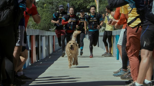 Simu Lui as Leo, Nathalie Emmanuel as Olivia, Mark Wahlberg as Michael, and Ali Suliman as Chik in Arthur the King