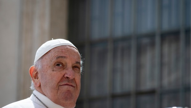 Pope Francis waves to the crowd during the weekly general audience on April 10, 2024 at St Peter's square in The Vatican.