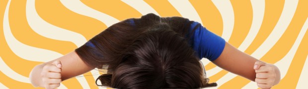 Stressed teen girl yellow background