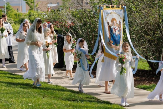 May crowing procession with handmade banner of Our Lady of Walsingham